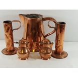6 Various copper jugs, largest is 12'' tall and including a pair of art nouveau inspired examples