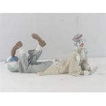 Large Lladro clown figure laying down with beach ball