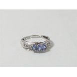 9ct White gold 3 stone tanzanite ring in modern design setting with diamonds