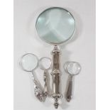 Large magnifying glass with 3 smaller examples