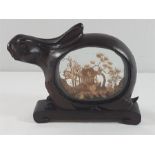 Oriental cased cork carving in hardwood rabbit shaped case