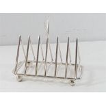 Silver plated toast rack in the style of Christopher dresser