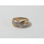 9ct Gold ring set with a row of diamond to form a modern twist design