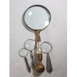 Large magnifying glass with 3 smaller examples