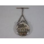 Embossed miniature round (probably silver) metal scent bottle with T bar pendant
