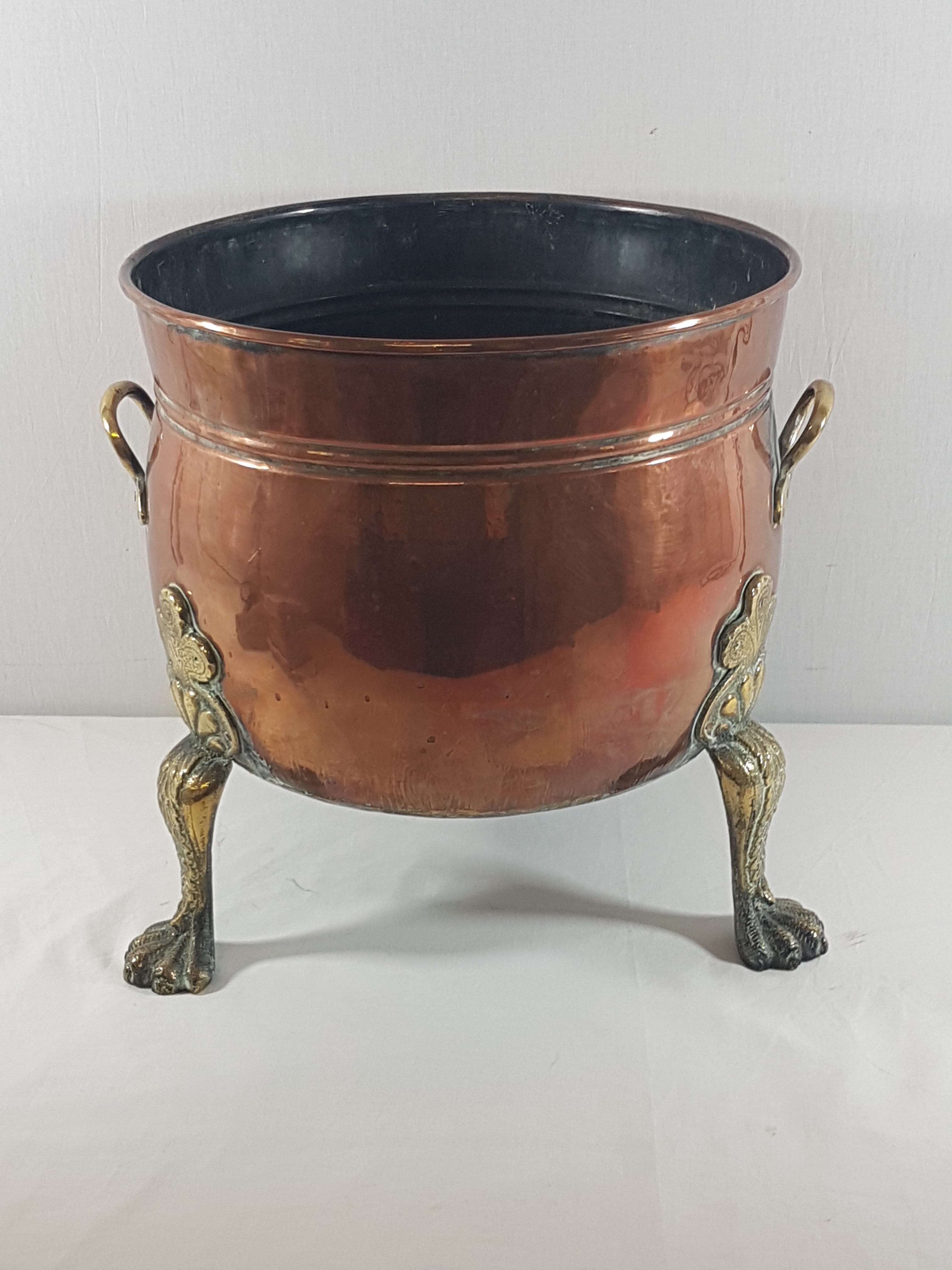 Large copper & brass planter terminating on 3 ornate legs, 14'' diameter and 14'' tall