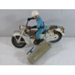 Vintage tin plate battery operated cable rc Honda motorcycle and rider.