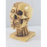 Cold cast skull and muscle head figure