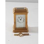 Brass cased carriage clock with key, approx 3'' tall