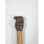 Cast metal topped walking stick in the form of a rodent type animal