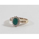 9ct Gold Caversham emerald ring surrounded by diamonds and 3 diamonds set to each sholder