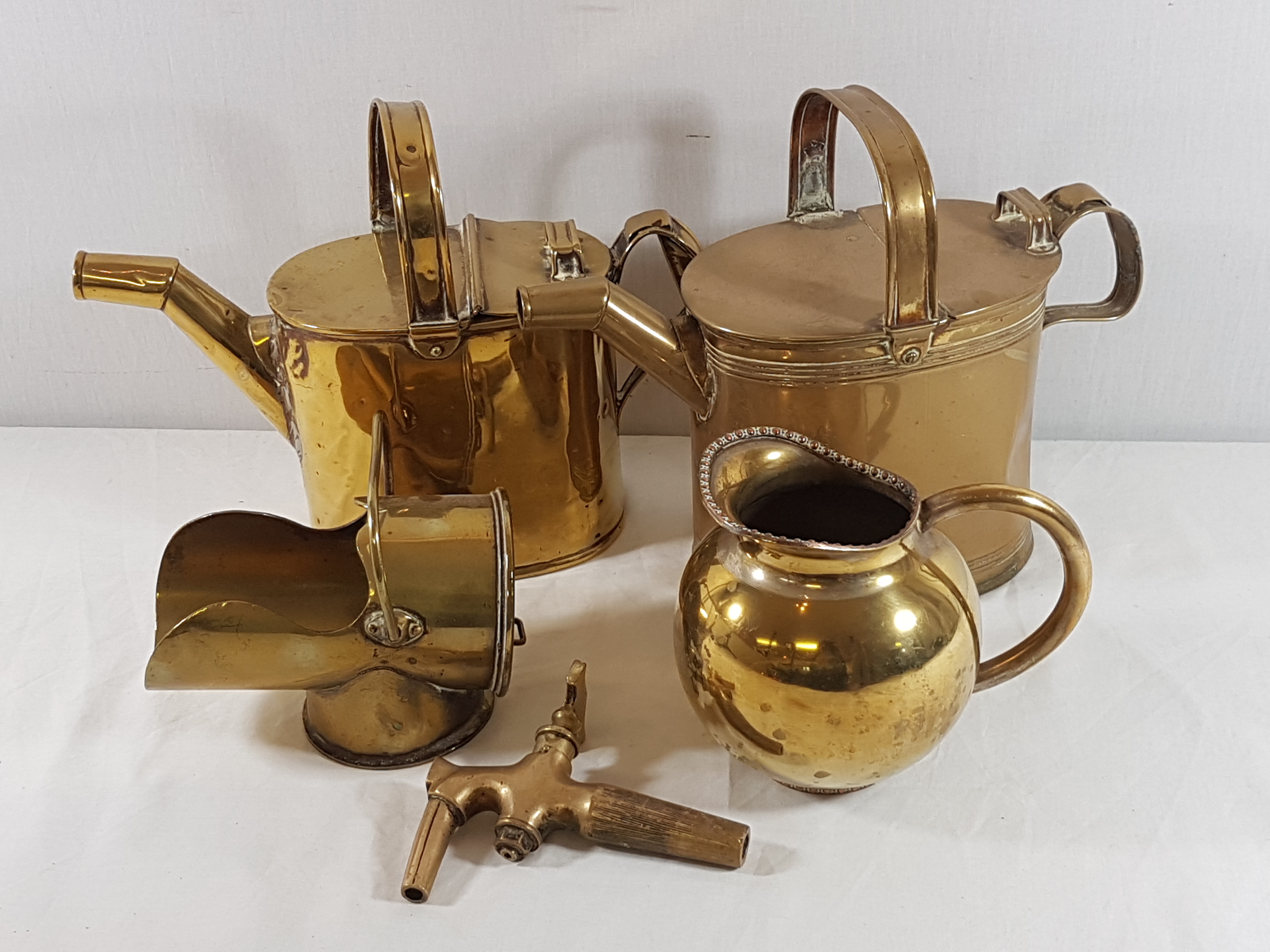 2 Brass watering cans,keg tap, trench art scuttle and jug