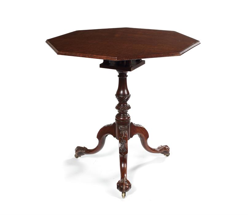 A mid 18th century carved mahogany tripod table