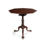 A mid 18th century carved mahogany tripod table