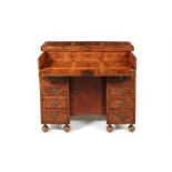 A Louis XIV kingwood crossbanded and parquetry kneehole desk