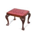 A George III Irish carved mahogany stool