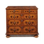 A George I walnut, sycamore and ebony foliate marquetry chest