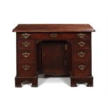 A George III mahogany kneehole dressing table/desk