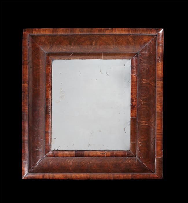 A small William & Mary walnut oyster veneered mirror