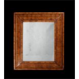 A large William & Mary walnut oyster veneered mirror