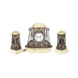 An Art Deco onyx wrought iron and gilded clock garniture in the manner of Edgar Brandt