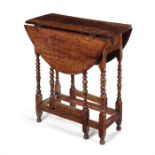 A small early 18th century walnut gateleg table