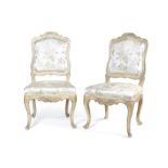 A pair of Louis XV cream painted carved chaises
