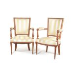 A pair of Louis XVI beechwood carved fauteuils