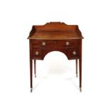 A small late George III mahogany bowfront dressing table