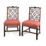 A pair of Chinese Chippendale style mahogany carved dining chairs