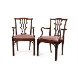 A pair of late 19th century Chippendale Gothic style open armchairs