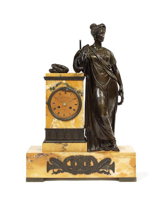 A large mid 19th century siena marble and patinated bronze figural clock by E.Courtin