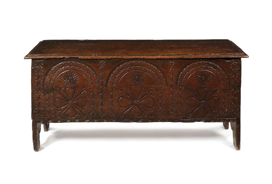 An unusual Elizabethan or James I chestnut and punch-decorated plank chest