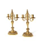 A pair of early 19th century Louis XIV style gilt bronze twin-light candelabra