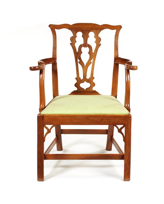 An unusual George III yew wood open armchair