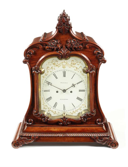 A Victorian carved mahogany bracket clock signed for Roskell, Liverpool