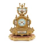 A late 19th century French Louis XVI style gilt-metal clock with Sevres style mounts