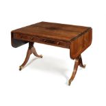 A large Regency rosewood and patridgewood crossbanded sofa table attributed to Gillows