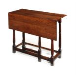 A George II figured oak folding table with single drop-leaf