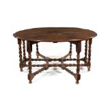 A large 17th century style oak double gate-leg dining table