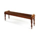 A Regency mahogany scroll end hall bench