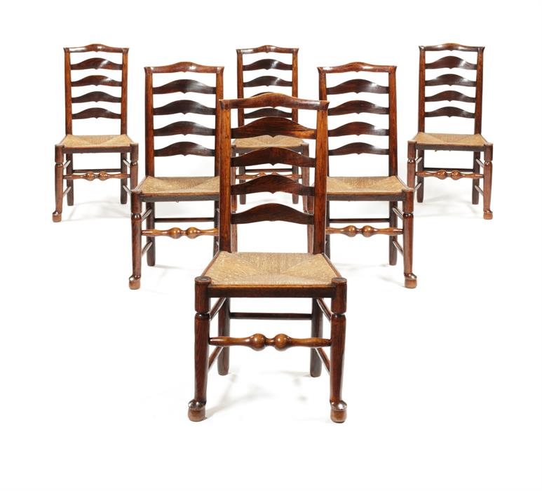 A true set of six George III ash ladder-back chairs, Lancashire