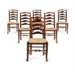 A true set of six George III ash ladder-back chairs, Lancashire