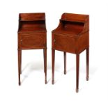 A pair of late George III mahogany bedside cupboards