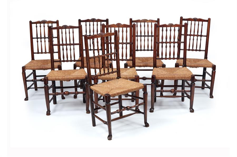 A set of eight early Victorian ash and birch ‘fan’ or ‘Liverpool’ spindle-back rush-seated chairs