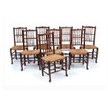 A set of eight early Victorian ash and birch ‘fan’ or ‘Liverpool’ spindle-back rush-seated chairs