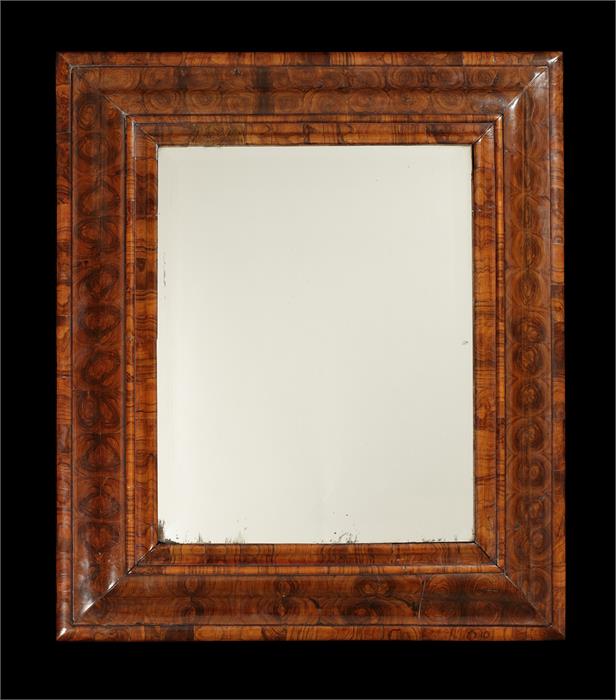 A William & Mary olivewood oyster-veneered cushion frame mirror