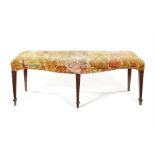 A George III satinwood and polychrome painted serpentine window seat