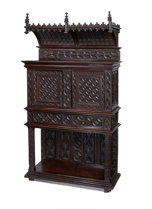 A late 19th century Gothic style carved oak canopy cupboard