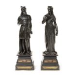 A pair of late 19th century French patinated bronze male and female Egyptian figures